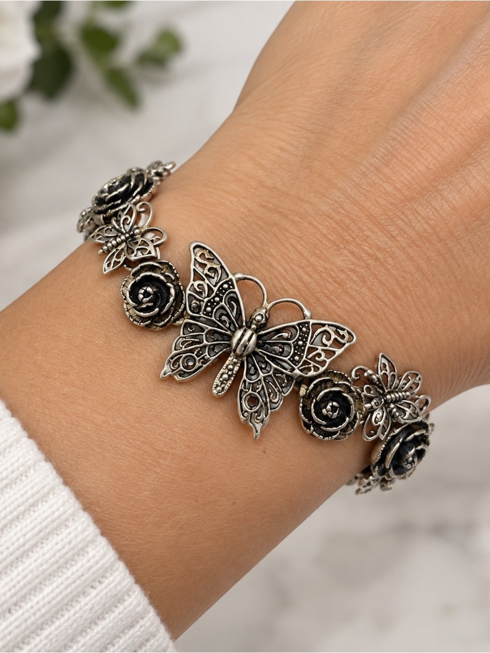 vintage silver 925 bracelet featuring ornate butterfly centerpiece roses